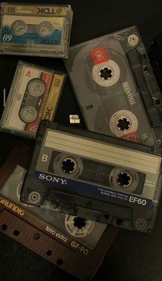 several old cassette tapes are stacked on top of each other, with the words sony printed on them