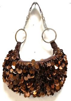 Sequin Handbags  are   hand-made, high quality, original designs, and beautiful. They are unique for evenings and special events and their designs are inspired by contemporary fashion and vintage looks. Sequin handbags are a perfect balance of aesthetics and functionality. Size: 1"x8" Large Trendy Hobo Bag With Removable Pouch For Party, Brown Hobo Bag With Handles For Evening, Vintage Handheld Bag For Party, Luxury Hobo Shoulder Bag For Party, Brown Hobo Bag For Evening, Elegant Pouch Hobo Bag For Parties, Elegant Satchel Hobo Bag For Party, Brown Handheld Hobo Bag For Evening, Elegant Party Pouch Hobo Bag