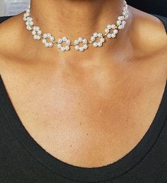 Whether you're attending a special occasion or simply want to feel fabulous, our Floral Pearl Choker is the perfect accessory to make a statement and leave a lasting impression. Embrace your inner charm and let this enchanting piece adorn your neck with sheer elegance. Elegant Rhinestone Necklace For Celebrations, Silver Adjustable Bridal Necklace For Party, Delicate Bridal Necklace For Formal Occasion, Feminine Evening Pearl Jewelry, Elegant Beaded Choker For Evening, Glamorous Metal Bridal Necklace For Weddings, Adjustable Clavicle Chain Jewelry For Party, Chic White Choker Jewelry, Adjustable Clavicle Chain For Parties