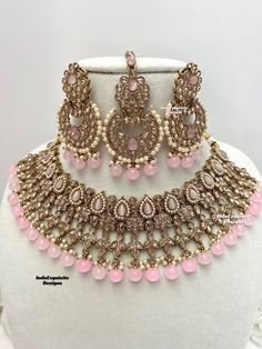 Gorgeous Antique gold Polki Necklace Set comes with beautiful earrings and tikka / Indian Jewelry/ High Quality Kundan and Polki Jewelry/ Bollywood Jewelry/Wedding Jewelry/baby pink  All items are shipped from Brampton, Ontario, Canada. If you need your item by a certain day, please reach out to us for express delivery option before placing the order so that we can update the shipping for you. Standard shipping/delivery timeline Below are the estimated delivery times after the order is shipped/d Traditional Pink Tikka For Celebration, Pink Bridal Sets For Party And Festive Occasions, Pink Bridal Sets For Party, Festive Pink Bridal Sets For Party, Pink Bridal Sets For Festive Occasion Gift, Pink Bridal Sets For Festive Gift, Pink Bridal Sets For Festive Occasion, Pink Festive Tikka, Festive Pink Bridal Sets As A Gift