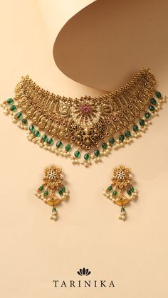 Crafted with intricate Nakshi work, this set exudes a vintage charm that will captivate all. Elevate your style and make a statement with this mesmerizing choker set, perfect for adding a touch of sophistication to any occasion. Intricate Design Choker For Receptions And Festivals, Intricate Design Choker For Reception And Festivals, Intricate Design Bridal Choker For Festivals, Festive Temple Jewelry Choker For Reception, Bridal Choker Necklace With Intricate Design For Festive Occasions, Festival Bridal Necklace With Intricate Design Choker, Festive Bridal Choker Necklace With Intricate Design, Festive Bridal Choker With Intricate Design, Ornate Kundan Necklace With Peacock Design For Wedding