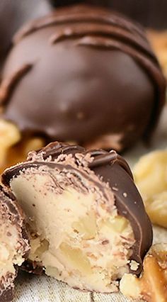 some chocolate covered donuts sitting on top of a table