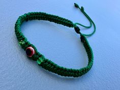 Es una Pulsera tejida con hilo verde y tiene como tema principal un ojo turco color rojo adornada con cristales verdes en cada lado además es ajustable Mirar las fotografías para más detalles  Excelente regalo para alguien muy especial  Gracias por su apoyo Green Adjustable Jewelry For Festivals, Green Adjustable Jewelry For Festival, Green Adjustable-length Jewelry For Festival, Adjustable Green Evil Eye Bracelets, Adjustable Green Evil Eye Bracelet, Green Resizable Bracelets For Festivals, Green Adjustable Bracelet For Festivals, Green Adjustable Bracelets For Festival, Green Adjustable Bracelets For Festivals