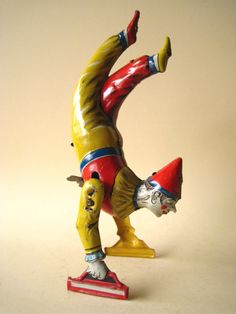 a figurine of a clown on a skateboard