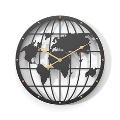 a black and gold clock with the world on it