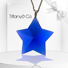 This Is A Beautiful Eye Catching Piece From Tiffany & Co. It Is A Multifaceted Crystal Star In The Color Blue With A Secure Bale Attache. The Tiffany Pendant Includes A Tiffany Necklace Chain. They Are Both Pre-Owned. No Kinks In The Chain. The Pendant Has Come Chips On Some Corners Of The Star But Not Noticeable And Not Harmful Or Dangerous. This Is In Need Of A Good Home. No Tiffany Packaging Is Included But Will Be Packaged With Great Care. Please See My Other Listings For More Tiffany & Co., David Yurman And Ippolita Jewelry Also. Tiffany Chain Necklace, Tiffany Packaging, Tiffany Pendant, Ippolita Jewelry, The Color Blue, Tiffany Necklace, Beautiful Eye, Crystal Stars, Star Pendant