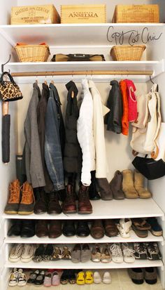 an organized closet filled with shoes and coats