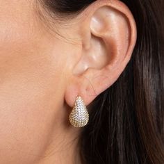 Add a touch of elegance to your outfit with the Celine Mini CZ Raindrop earrings. The sparkling CZ raindrops will catch the light and draw attention, elevating your look to the next level. Perfect for a night out or special occasion, these earrings are a must-have for any fashion-forward individual. * 18k Gold Plated * CZ Stones * Hypoallergenic * Water & Tarnish Resistant Glamorous Drop Diamond Earrings, Glamorous Teardrop Diamond Earrings For Party, Teardrop Diamond Earrings With Sparkling Stones For Party, Sparkling Drop Diamond Earrings, Pear-shaped Diamond Earrings For Party, Sparkling Stones Teardrop Earrings For Evening, Long Drop Diamond Earrings For Party, Party Long Drop Diamond Earrings, Pear-shaped Teardrop Earrings For Evening