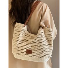 Natural beige colored woven tote bag. It has a distinctive soft texture and is accented with a brown leather strap. Items that will enhance your vacation mood. The atmosphere is casual and relaxed. 
 
 
 Size 
 
 
 FREE size 
 
 Height: 24cm 
 Width: 39cm 
 Depth: 9cm 
 
 
 
 
 
 Material 
 
 Polyester 
 Synthetic leather Casual Beige Tote Shoulder Bag, Casual Light Brown Crochet Travel Bag, Casual Light Brown Crochet Bag For Travel, Casual Light Brown Shoulder Bag For Vacation, Summer Beige Tote Shoulder Bag, Casual Beige Tote Beach Bag, Casual Brown Woven Beach Bag, Casual Beige Beach Tote Bag, Chic Light Brown Shoulder Bag For Vacation