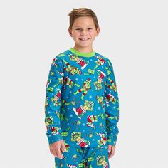 From drifting off to bed to dreaming of action-packed adventures, your kid will love wearing the Teenage Mutant Ninja Turtles 2-Piece Cozy Pajama Set and Socks. This green pajama set includes a long-sleeve sleep shirt and a pair of pajama pants, both covered with a print of the Ninja Turtles and stars, plus matching socks for an adorable look. Made from soft fabric, the pieces offer both comfort and warmth. Green Pajama Set, The Ninja Turtles, Matching Socks, Cozy Pajamas, Pajama Pant, Kids Clothes Boys, Boys Christmas, Teenage Boys, Sleep Shirt