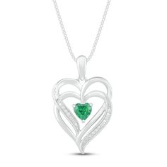 This pretty necklace for her features a double heart-shaped pendant traced in shimmering diamond accents. At the center sits a beautiful heart-cut lab-created emerald to complete the romantic design. The sterling silver pendant is suspended from an 18-inch box chain and secures with a lobster clasp. Heart-shaped Emerald Jewelry For May Birthstone, Heart-shaped Emerald Jewelry For Valentine's Day, Heart-shaped Emerald Jewelry With Birthstone, Heart-shaped Emerald Birthstone Jewelry, Heart-shaped Emerald Necklaces For Anniversary, Heart-shaped Emerald Necklace For Anniversary, Anniversary Heart-shaped Emerald Necklace, Valentine's Day Heart Shaped Emerald Jewelry, Fine Jewelry Heart Pendant For May Birthstone