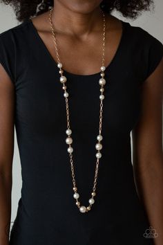 Capped in ornate gold frames, a collection of bubbly white pearls and glistening gold beads trickle along sections of shiny gold chain across the chest for a timeless sophistication. Features an adjustable clasp closure. Sold as one individual necklace. Includes one pair of matching earrings. Luxury Faceted Beads Necklace For Evening, Luxury Gold Beaded Necklace For Formal Occasions, Gold-tone Pearl Chain Necklace, Gold-tone Pearl Necklace With Pearl Chain, Elegant Gold Metal Pearl Necklace, Gold Pearl Chain Jewelry For Party, Party Gold Jewelry With Pearl Chain, Elegant Gold Pearl Necklace, Gold Beaded Pearl Necklace For Formal Occasions