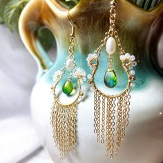 Perfect to style when want go out and add a statement to your look. with these lovely handcrafted earrings, very light and comfortable to wear ❤️M A T E R I A L : - Freshwater pearl - Japanese beads - Royal green blue Czech glass teardrops - S925 gold filled hook - 14K Gold filled cershain ❤️ A B O U T Me All pieces are designed and made by me in Australia. I am in love with the wild botanical, Therefore i want to bring inspiration to everyone that loves nature. ❤️ P A C K A G I N G - All items Elegant Handmade Long Drop Tassel Earrings, Elegant Long Drop Handmade Tassel Earrings, Handmade White Long Drop Teardrop Earrings, Dangle Tassel Earrings With Pearl Drop For Gifts, Elegant Tassel Teardrop Earrings, Elegant Teardrop Tassel Earrings, White Bohemian Teardrop Earrings For Pierced Ears, White Bohemian Teardrop Earrings, Bohemian Beaded Drop Earrings With Pearl