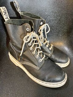 Vintage Dr. Marten Black with White Air Wair Soles and heels Ladies Size 9 to 9.5 Nothing better to bounce around in than a Classic and Cool pair of Docs.  These have the classic air wair bouncing soles and heels.  Also, they are oil resistant. Shoes feature 8 pairs of grommets for lacing up the front and beautiful white stitching, all intact.  Condition is good some scratches on one toe, and one mark on exterior, inside is clean, and chunky white soles and heels are in good condition.  "Dr. Mar Black Lace-up Ankle Boots With Stitched Sole, Black Ankle Lace-up Boots With Stitched Sole, Black Lace-up Boots With Stitched Sole For Fall, Alternative Style Black Ankle Boots, Alternative Style Black Closed Toe Boots, Alternative Black Closed Toe Boots, Black Closed Toe Alternative Boots, Laced Work Boots For Streetwear, Lace-up Work Boots With Round Toe For Streetwear