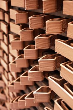 several stacks of wooden boxes stacked on top of each other