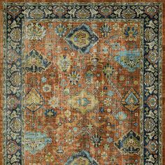 an orange and blue rug with many different colors