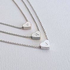 "Sterling Silver Heart Bracelet Delicate Heart Bracelet Tiny Heart Bracelet Bridesmaid Gift Minimalist Jewelry Initial Bracelet A delicate Sterling silver heart bracelet with your choice of initial stamp on it. This Bracelet makes a perfect gift for, birthdays, anniversaries and graduations. You can also present these as gift to your bridesmaids, sorority sisters and best friends in a cute gift box that will adore and appreciate! We put a tremendous attention to details, in order to make each pi Tiny Heart Bracelet, Silver Bar Bracelet, Tiny Heart Necklace, Sterling Silver Heart Bracelet, Coordinates Bracelet, Sister Bracelet, Silver Heart Bracelet, Sterling Silver Heart Necklace, Sorority Sisters