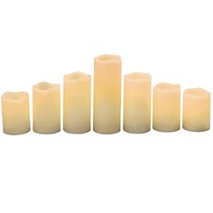 candles are lined up on a white background