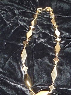 "This is an estate find that appears to have not been worn much. It's a very substantial 15\" choker by Monet that weighs 2.5oz. very bright shiny gold with geometric pattern. Interesting it has an extender on it that I have not seen before - also marked Monet so it can be taken off which makes it a 14\" necklace." Gold Costume Jewelry Choker For Evening, Formal Metal Costume Jewelry Choker, Formal Metal Costume Choker, Gold Metal Evening Necklace, Gold Metal Necklaces For Evening, Gold Metal Necklace For Evening, Gold 16 Inch Costume Jewelry Necklace, Gold 16 Inch Costume Jewelry, 16 Inch Gold Costume Jewelry Necklace