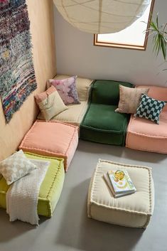 a living room filled with lots of different colored furniture