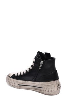 Predistressed details give punk-rock attitude to a rugged high-top sneaker crafted with sleek leather and a star-studded toe bumper. Leather upper/leather and textile lining/rubber sole Imported Edgy Studded High-top Sneakers, Black Urban High-top Sneakers With Studded Outsoles, Black Leather High-top Sneakers With Spikes, Black High-top Sneakers With Perforations, Black Leather High-top Sneakers With Perforations, Punk Rock, High Tops, High Top Sneakers, Sleek