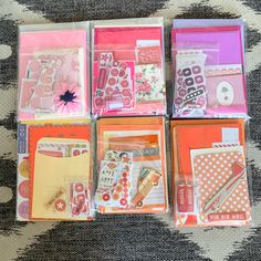 several different types of cards and envelopes on a tablecloth with polka dot designs