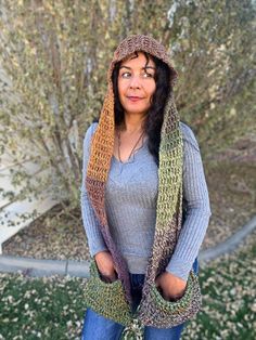 Description: This hooded scarf is for anyone that likes earthy colors and likes being warm yet fashionable at the same time. Crochet Hoodie Scarf, Hooded Pocket Scarf Crochet, Womens Crochet Hooded Scarf, Wild Oleander Hooded Scarf, Woodland Hooded Scarf With Pockets, Hooded Scarf, Earthy Colors, Scarf Wrap, Scarf Accessory