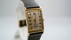 "For Sale: (1)K038 1950's Vintage Hamilton 14k Gold Watch PLEASE READ ENTIRE DESCRIPTION BEFORE PURCHASING Amazing 14k yellow gold Hamilton watch. Perfect for a graduation present or an anniversary gift. Specifics: Hamilton Approximately Automatic Case width: 19.0 mm Lug width: 18 mm Length: 6\" Weight: 24.5 grams **Please be patient & allow up to several weeks for delivery** (Despite the \"estimated delivery date\") (We've had packages reach their destination within a few days, others have Gold Watch Bands With Date Display For Formal Occasions, Antique Yellow Gold Watch Bands For Formal Occasions, Retro Yellow Gold Watches For Formal Occasions, Retro Gold Watch Accessories For Formal Occasions, Retro Yellow Gold Formal Watch, Vintage Gold Watch Bands For Business, Vintage Gold Watch Bands For Formal Occasions, Vintage Yellow Gold Watch Accessories For Business, Formal Yellow Gold Watch With Date Display