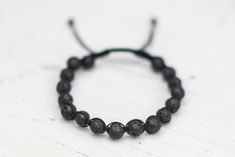 Handmade black lava rock bracelet with black nylon string and adjustable closure. Lava Rock Bracelet, Celtic Knot Designs, Lava Rock, Tucson Az, Black Nylon, Celtic Knot, Black Nylons, Adjustable Bracelet, Tucson