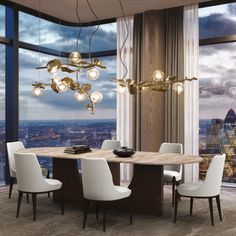 a dining room table with chairs and a chandelier hanging from the ceiling