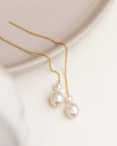 "Ear Thread Earrings with Pearl in Gold filled or Sterling Silver Elegant drop earring featuring freshwater pearls with dainty Gold Fill or Sterling Silver chain. Perfect bridesmaids gift or for bridal jewelry * 1 Pair * Total length of the threader measures about 3.5\" from end to end * Sterling silver or Gold filled * Fresh water pearls * Perfect gift for Bridesmaids, Bride Our pearl jewelry: https://www.etsy.com/shop/EandEProject?ref=simple-shop-header-name&listing_id=1230926220&search_query= Delicate Dangle Pearl Pendant Earrings, Delicate Pearl Pendant Dangle Earrings, Delicate Dangle Bridal Earrings With Pearl Pendant, Delicate Bridal Dangle Earrings With Pearl Pendant, Elegant Teardrop Threader Earrings For Wedding, Delicate Dangling Beads Earrings For Wedding, Pearl White Drop Earrings With Pearl Chain For Bridal, Delicate Pearl Drop Linear Earrings, Pearl White Dangle Bridal Earrings With Pearl Pendant