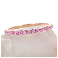 This feminine light pink sapphires eternity band is the perfect complement to any engagement ring or as stackable bands. •Based on ring size 6.5•Metal: 18K Rose Gold•Stones: Genuine Sapphires•Color: Light Pink •Stone Count: 44 PCS•Weight: 0.43cts T.W •Band Width: 1.5mm ( +/- 0.1mm in variation)----------------------------------------Carat weight & stone count varies depending on the ring size.----------------------------------------Beautiful Ring Box Included -------------------------------- Pink Sapphire Stackable Ring In Fine Jewelry Style, Pink Sapphire Stackable Ring For Anniversary, Pink Eternity Band With Prong Setting As Promise Ring, Pink Diamond Half Eternity Band, Pink Half Eternity Diamond Band, Pink Diamond Stackable Rings, Elegant Pink Sapphire Stackable Ring, Pink Diamond Stackable Rings With Prong Setting, Pink Eternity Band With Prong Setting