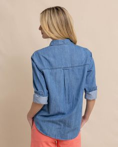 Classic, comfortable, and casual collide in our long-sleeve denim shirt. The cozy feel of 100% cotton is crafted into a classy button-down with button cuffs and a shirttail hem. Use it as a layering piece, or wear it tucked into your favorite pair of white jeans. Style: 10852 Classic Light Wash Long Sleeve Denim Top, Classic Long Sleeve Light Wash Denim Top, Cotton Shirt With Roll-up Sleeves And Shirttail Hem, Casual Denim Tops For Layering, Classic Cotton Denim Top For Spring, Spring Washed Blue Tops With Button Cuffs, Trendy Shirt With Roll-up Sleeves For Everyday, Washed Shirt For Everyday Spring Wear, Everyday Shirt With Rolled Sleeves And Shirttail Hem