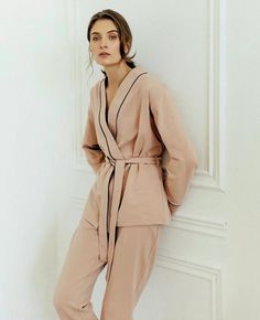 These natural pajamas are made of soft cotton knitwear fabric (jersey) and are perfect for sleep, parties, or everyday use. Our luxurious, temperature-regulating knit fabric drapes and falls in all the right ways, enveloping the body in comfort. Plus, it's machine washable and gentle on the skin, so it not only feels beautiful but it's easy to care for, too. These are the cozy, relaxed PJs you'll live in, a gift to everyone, and pack with you wherever you go. Composition: 95% cotton, 5% elastin (it helps to be like a second skin because of stretching features) We could advise more colors for this set: black, beige, white, dark blue, and light pink. Please, write to me, if you want to change the color. The set includes a long sleeve kimono and matching pajama pants. With pockets. We suggest Beige Long Sleeve Sets For Home, Beige Long Sleeve Sleepwear For Pajama Party, Beige Long Sleeve Sleepwear Set, Beige Long Sleeve Sleep Set, Beige Long Sleeve Bedtime Sets, Cotton V-neck Sleepwear For Loungewear, Beige Long Sleeve Sets For Daywear, Beige Long Sleeve Daywear Set, Cotton Lounging V-neck Sets