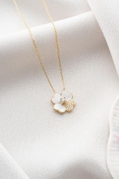 Pure White Clover Necklace, 925 Sterling Silver,  Four Leaf Clover Pendant, Tiny Floral  Necklace, Lucky Clover Pendant, Irish Shamrock Charm, Heart Clover Charm, Anniversary Gifts, Perfect Gift for Her 🍀✨ In the purity of white clover, grace and luck intertwine, where the pristine petals hold the secret to a world blanketed in the elegance of white. 🍀✨ Materials: High Quality 925 Sterling Silver * Zircon Stone * Rose Gold Plating Chain: 925 Sterling Silver Chain is included in price. Chain Length: 17 inches (42 cm) Pendant width: 0.55 inches (1.40cm) Pendant height: 0.55 inches (1.40cm) ✔️ FREE & Express SHIPPING to the US, Canada, UK and EU countries. ✔️ All your orders are shipped with a valid tracking code. ✔️ Premium Packaging with all orders ready to gift ✅ Care Instructions: You s Dainty White Pendant Jewelry, White Flower Pendant Necklace With Clavicle Chain, Dainty White Round Flower Necklace, White Flower Clavicle Chain Necklace, White Sterling Silver Jewelry With Flower Charm, White Flower-shaped Clavicle Chain Jewelry, White Dainty Flower Necklace, Fine Jewelry White Pendant Necklace, White Pendant Necklace Fine Jewelry