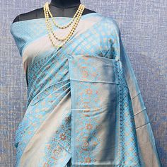 Light Blue colored saree is made from banarasi silk fabric which is highlighted with beautiful weaving work as shown. Comes along with unstitched banarasi silk blouse piece which you can customise as per your design/style. Occasion - You can wear this saree for festivals and functions. Note:- the actual product may differ slightly in color and design from the one illustrated in the images when compared with computer or mobile screen. Measurements: Saree : Banarasi Silk : 5.5 Mtrs Blouse : Banarasi Silk : 0.8 Mtr Material: Banarasi Silk Stitch Type: Unstitched Country of Origin: India Care Guide: Dry Clean Designer Blue Pre-draped Saree With Zari Weaving, Blue Saree Blouse With Traditional Patterns, Light Blue Unstitched Blouse Piece For Festivals, Traditional Light Blue Blouse Piece With Cutdana, Blue Pre-draped Saree With Zari Weaving For Designer Wear, Blue Saree For Traditional Ceremonies, Designer Blue Blouse Piece With Zari Weaving, Traditional Light Blue Zari Work Blouse Piece, Blue Chanderi Blouse Piece With Traditional Patterns