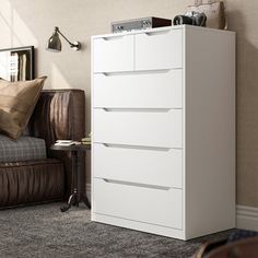 a white chest of drawers in a living room