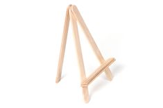 a small wooden easel on a white background