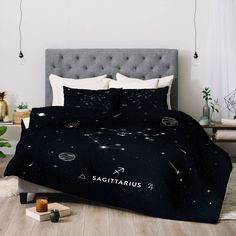 a bed with black and gold stars on it