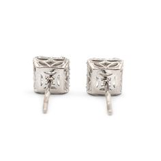 Brand: Tacori  Gender: Ladies  Metal Type: 18K White Gold  Length: 0.50 Inches  Width: 6.50 mm  Weight: 2.10 grams  Ladies filigree-style 18K white gold diamond halo stud earrings with push backs. Engraved with "18K". The "Tacori" trademark (or hallmark) can also be found on the item.  Pre-owned in excellent condition. Might shows minor signs of wear.  V-Prong Set in 18 Karat White Gold with:  Two (2) princess cut natural diamonds:  Measurements: 4.88mm x 5.00mm x ~3.50mm in depth. Weight Range: Luxury Platinum Diamond Earrings Hallmarked, Elegant Platinum Diamond Earrings Gift, Classic Diamond Cut Bridal Earrings For Evening, Elegant Platinum Diamond Earrings For Formal Occasions, Platinum Earrings As A Gift, Luxury Hallmarked Diamond Earrings For Formal Occasions, Platinum White Gold Bridal Earrings With Diamond Cut, Luxury Platinum Bridal Earrings, White Platinum Hallmarked Earrings