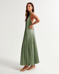 Elevate your wardrobe with the A&F Giselle Pleated Trapeze Maxi Dress, a stunning ensemble perfect for any elegant occasion. 

- Size: XL
- Color: Green
- Material: Body: Polyester, Lining: Polyester
- Gender: Female
- Features: All-over pleating, open back, halter neck band

This luxurious maxi dress showcases a flattering trapeze silhouette in a shiny satin fabric, designed to flow gracefully with every step. The intricate pleating details add a touch of sophistication, while the open back and Satin Maxi Dress With Pleated Back For Evening, Evening Satin Maxi Dress With Pleated Back, Abercrombie And Fitch Dress, Spring Gala Floor-length Satin Dress, Summer Satin Maxi Dress With Pleated Back, Satin Pleated Maxi Dress For Gala, Spring Silk Maxi Pleated Dress, Pleated Satin Maxi Dress For Evening, Evening Pleated Satin Maxi Dress