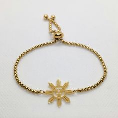 This lovely Bracelet will show off your Filipino Pride.  Great Gift! Item: Filipino Sun and Stars Bracelet Sun Size: .85" Bracelet Size: Adult Adjustable  Color: Gold Material: Stainless Steel/Gold Plated Hypoallergenic finish Adjustable Metal Bracelet With Star Charm, Adjustable Gold Chain Bracelet With Star Charm, Star-shaped Metal Bracelets As Gifts, Adjustable Gold Star Chain Bracelet, Adjustable Gold Star-shaped Chain Bracelet, Adjustable Star Shaped Metal Bracelets, Adjustable Metal Star Bracelet, Adjustable Star-shaped Metal Bracelets, Adjustable Star-shaped Metal Bracelet