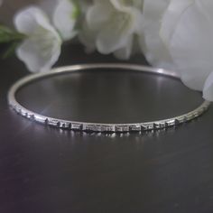 Elevate your style, your outfits, and your jewelry collection with this handmade solid S925 sterling silver diamond cut bangle bracelet. This stunning piece features intricate detailing that will make showcases craftsmanship, adds beauty to any outfit, and makes it a perfect gift. Please check out the chart in the photos to know your size. ◾D E T A I L S◾ ▪M A T E R I A L: This bangle bracelet is all handmade with care with the highest and bestest quality silver ▪D E S I G N: The design on this bangle bracelet it intricate, unique, and absolutely stunning and it is accomplished by diamond cuts.  ▪WHY YOU'LL LOVE IT: This unique sterling silver bangle bracelet is more than just a piece of jewelry; it's a statement of style and charm. The diamond cut design it stunning and gorgeous. Its beau Stackable White Gold Bangle As A Gift, Sterling Silver Stackable Diamond Bracelet As Gift, Stackable Sterling Silver Diamond Bracelet As Gift, Stackable Sterling Silver Diamond Bracelet Gift, Minimalist Sterling Silver Diamond Bracelet For Anniversary, Sterling Silver Diamond Cut Bracelet, Hallmarked Sterling Silver Diamond Bracelet, Silver Bangle As Fine Jewelry Gift, Fine Jewelry Silver Bangle As Gift