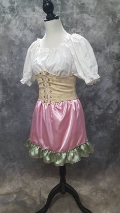 "Super cute and flirty A-line mini skirt made from Rose Pink poly satin with a ruffled bottom in Sage Green poly satin. This is a one of a kind item (OOAK) as I only had enough of each fabrics to make the one skirt. Size Large, elastic waist will fit waists from 34-39 inches (86.5-99 cm) . 18 inches in length BLOUSE AND WAIST CINCHER ARE NOT INCLUDED. THIS IS A FINISHED ITEM AND WILL SHIP WITHIN 48 HOURS OF COMPLETED PAYMENT. ✿This piece will be handmade entirely by me from design to completion Skirt Satin, Peasant Shirt, Steampunk Costume, Dance Skirt, A Line Mini Skirt, Waist Cincher, Satin Midi Dress, Ruffle Skirt, Festival Wear