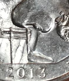 a close up of a coin with a person on it