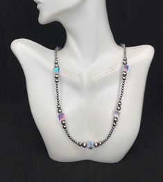 This is a high quality handmade Navajo Pearl silver bead necklace with Crystal. The silver beads are 3,5,6mm and the Crystal are 8mm. Necklace measures 18" long.  Necklace is handmade in USA and of Southwest origin. Thanks for looking and check out more items in my Etsy shop for more great items and deals! https://www.etsy.com/shop/925usa Payment: We accept all major credit cards through direct check out and Paypal. New Mexico residents have to pay sales tax. Payments must be made within 3 days Spiritual Silver Beaded Necklaces With Faceted Beads, Silver Necklaces With Spacer And Round Beads, Silver Single Strand Custom Necklace As Gift, Silver Single Strand Beaded Necklace As Gift, Silver Necklaces With 8mm Beads For Jewelry Making, Sterling Silver Beaded Necklace With Spacer Beads, Silver Necklaces With 8mm Sterling Silver Beads, Silver Beaded Necklace With Spacer And Oval Beads, Silver Beaded Necklaces With Faceted Beads