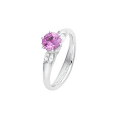 a white gold ring with an oval pink tourmaline in the center and diamond accents