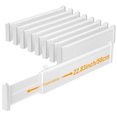 six white plastic dividers with an orange arrow pointing to each other