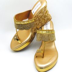 These stunning gold toe ring synthetic leather wedges with gold stones flower design with a braided trim are gorgeous. these beautiful platform heel shoes have embroidered design on the heels and lovely rhinestones design on toe. They offer a nice, sweet look, but enough to be unique and stand out when you wear them. They are comfortable to wear for long periods of time. Pictures don't do justice for these wedges. These offer a heel size of 4 inches. We have a wide variety of shoes to choose from. See our page for more of our collection! We ship out in a timely matter, wrapped in care for a safe secure trip to your location. Thank you for supporting our small business! Shipped from USA. Sizes available US 6,7,8,9,10. Gold Round Toe Wedding Shoes For Summer, Gold Toe Post Wedge Sandals, Gold Embellished Toe Post Sandals, Luxury Gold Platform Wedge Sandals, Elegant Gold High Heel Wedge Sandals, Gold Embellished Synthetic Sandals, Gold Open Toe Wedge Sandals For Formal Occasions, Gold Open-toe Wedge Sandals For Formal Occasions, Elegant Gold Wedge Sandals For Formal Occasions