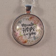 a glass pendant with the words, my only hope is in you